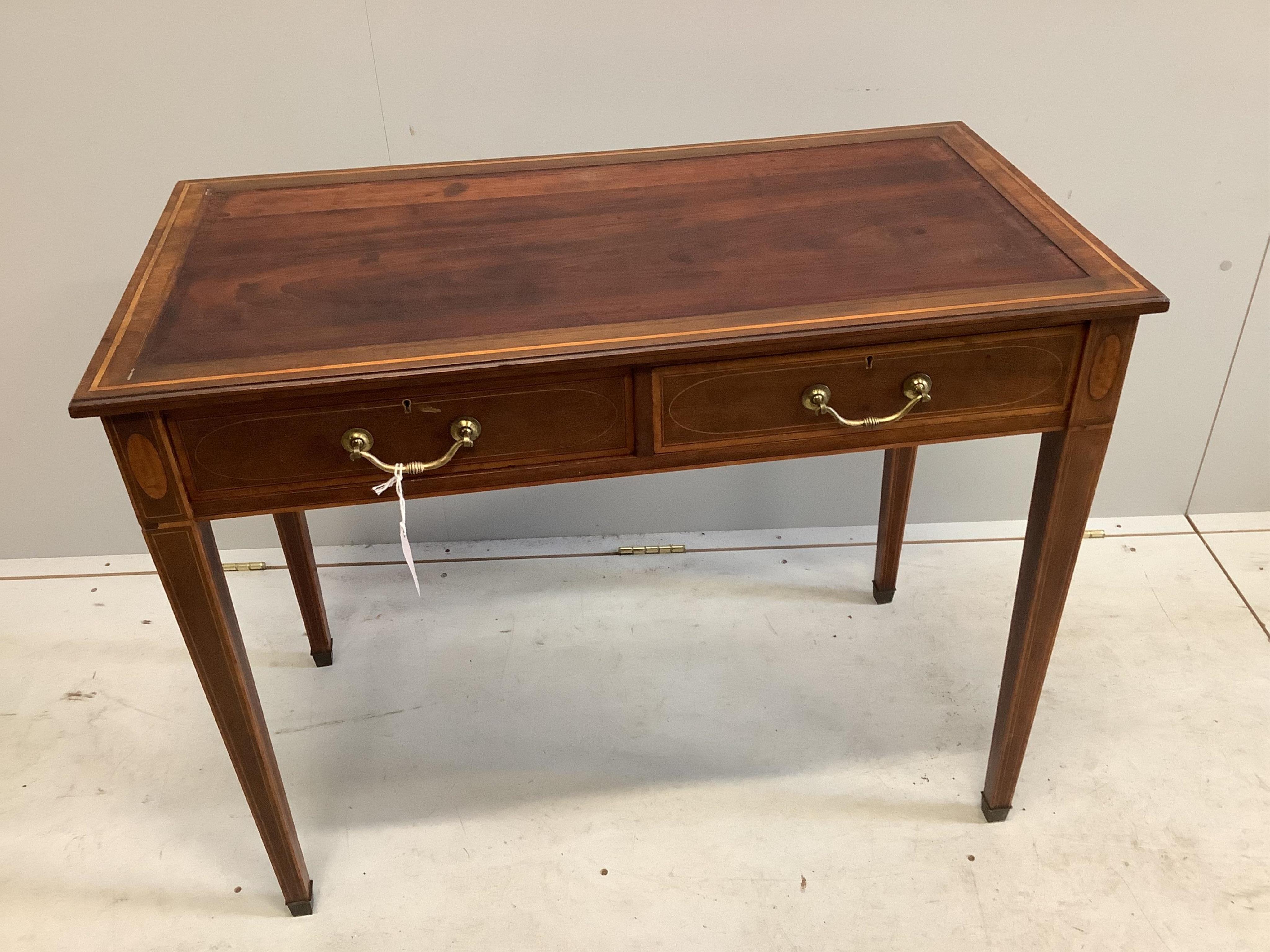 An Edwardian Edwards and Roberts satinwood banded mahogany writing table, width 91cm, depth 47cm, height 72cm. Condition - fair, lacks leather top